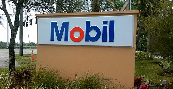 Mobil pole sign by Shark Signs LLC